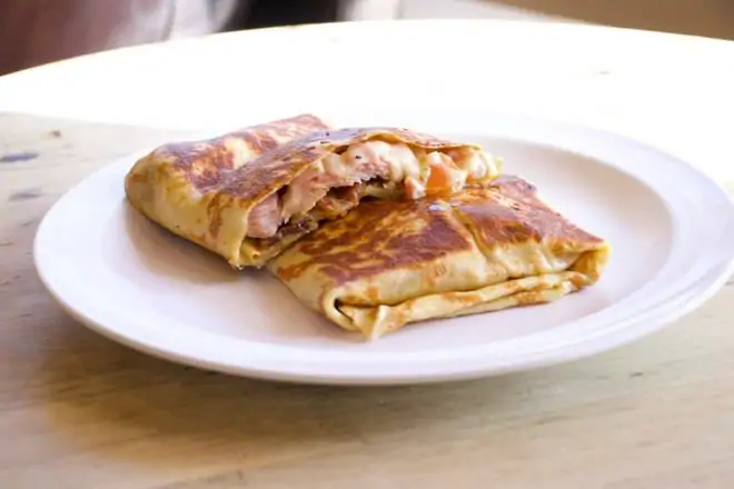 Egg & cheddar cheese. Scrambled eggs filled w/ cheddar on a fresh baked toasted croissant